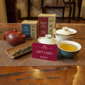 Eco-Cha Teas gift card next to tea leaves and brewed tea in teacups