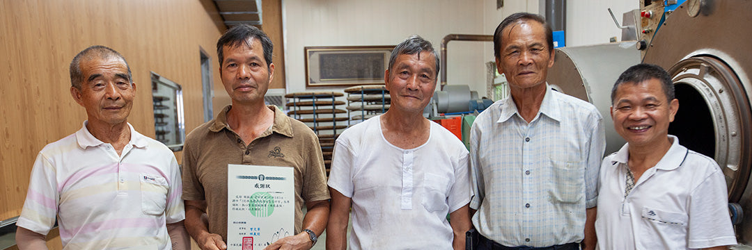 Traditional Dong Ding Oolong Tea master line up for a photo at a recent workshop to pass on traditional tea making skills and knowledge