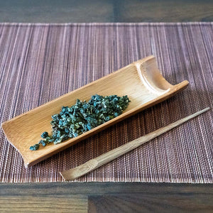 Bamboo Tea Scoop with tea leaves and Bamboo Tea Pick