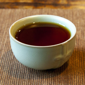 Eco-Cha Teas Celadon Tea Cup on brown mat
