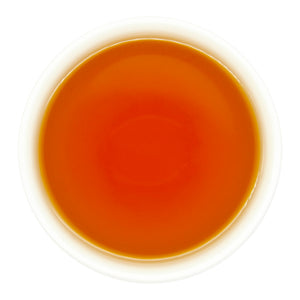 Charcoal Roasted High Mountain Oolong Tea brewed in a teacup, top view