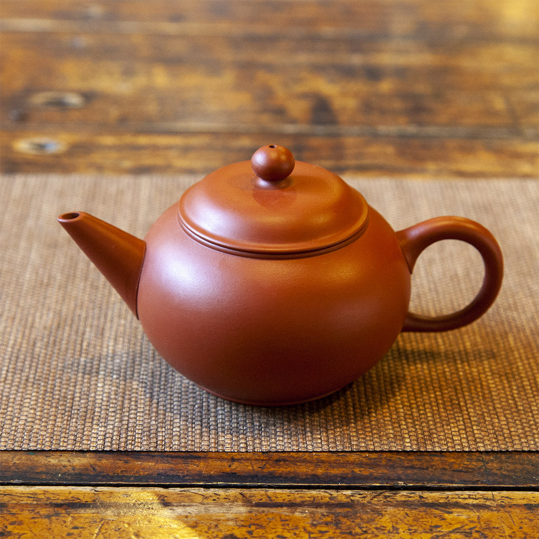 Clay teapot on table