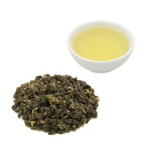 Eco-Farmed Green Tea leaves with brewed tea in cup