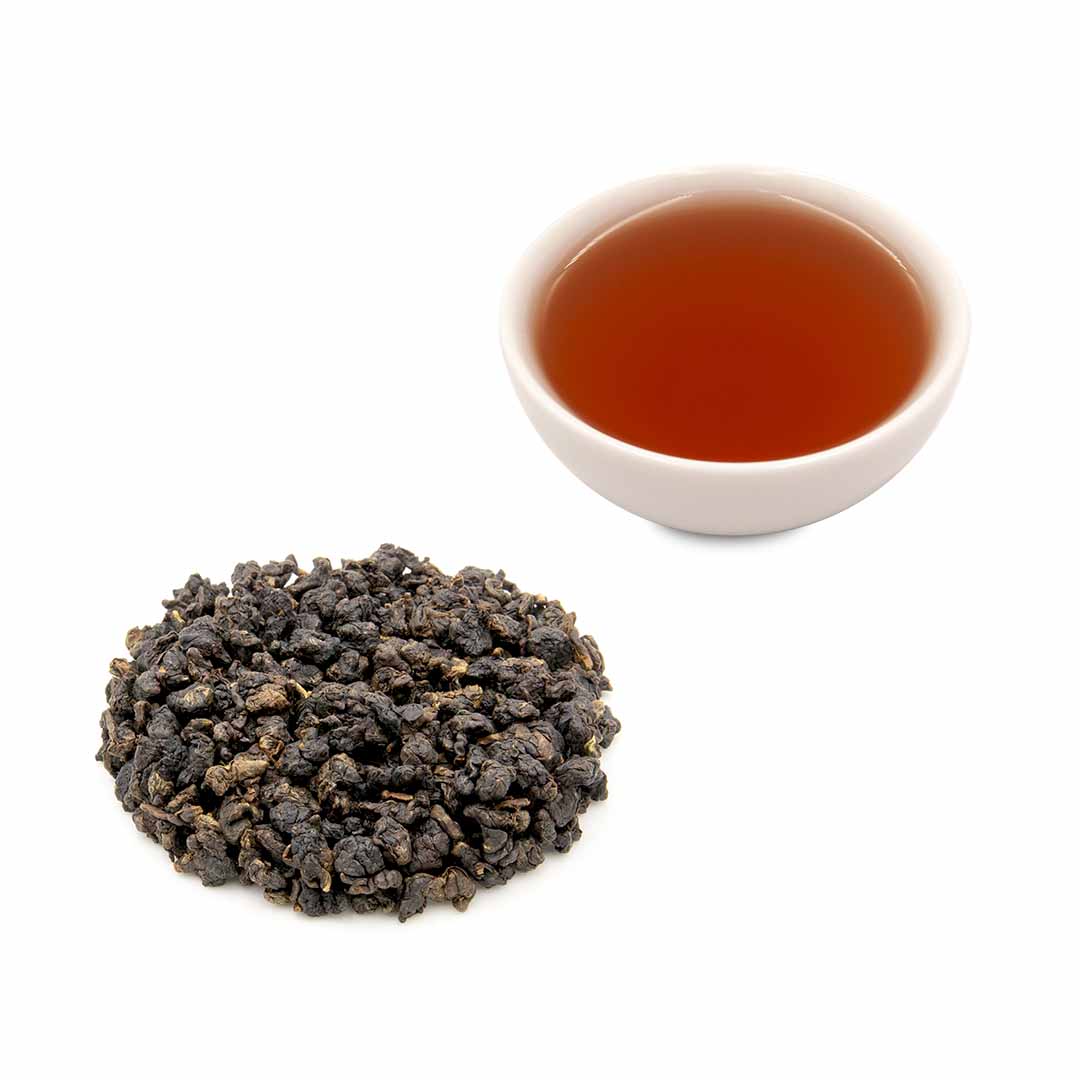 Hong Oolong Tea  dry leaves next to brewed tea in a cup
